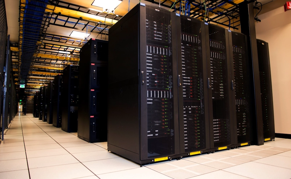 dedicated servers,A large data center room filled with rows of servers, showcasing a high-tech environment for data storage and processing